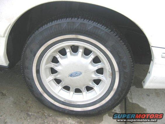 Close-up of a Ford wheel with a white stripe tire