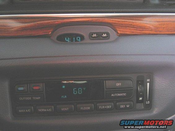dashboard with digital clock showing 4:19 and climate controls displaying 68 degrees