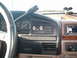 1996 Ford Bronco - Interior view of a 1996 Ford Bronco, showing the dashboard controls and steering wheel.