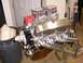 1978 Ford Mustang II - A V8 engine with chrome valve covers and dual carburetors sits on a stand.