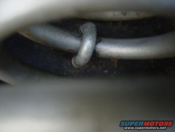 Metal pipes with a loop, part of a vehicle's undercarriage
