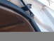 1996 Ford Bronco - Close-up of a door seal and wiring secured with tape on a white vehicle.