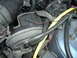 1994 Ford Probe - A detailed view of various engine components, including hoses and wiring harnesses, within a vehicle's engine bay.