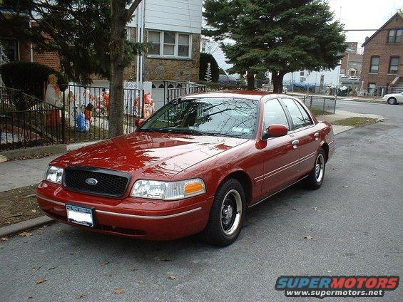 Red 1998 Ford Crown Victoria sedan, 3q front view