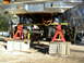 1985 Ford Bronco - Front end of a 1985 Ford Bronco undergoing work, supported by jack stands and cinder blocks.
