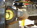 1985 Ford Bronco - Close-up view of a vehicle's driveshaft U-joint and differential housing.
