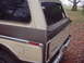 1979 Ford Bronco - Rear view of a 1978 Ford Bronco, showing its distinctive two-tone paint scheme and chrome accents.