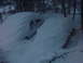 1995 Ford Mustang - Two vehicles are completely buried under a thick blanket of snow in a forest.