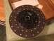 1989 Ford F-150 - A clutch disc is shown, part of a clutch replacement kit, with some text visible in the background.