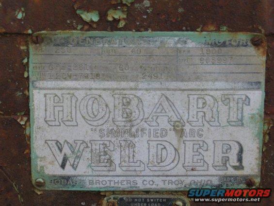 Metal data plate with raised lettering for Hobart "Simplified" Arc Welder, showing model and serial numbers