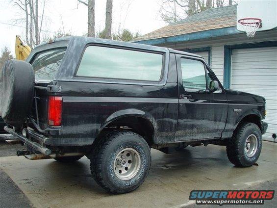 Black 1996 Ford Bronco, rear quarter view, with spare tire mounted externally