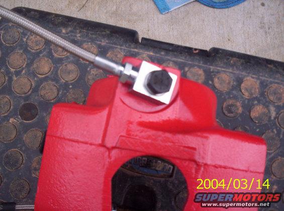 Heres the lines attached to the caliper.  Make sure not to overtighten the bolt.  You don't want to strip those threads.  