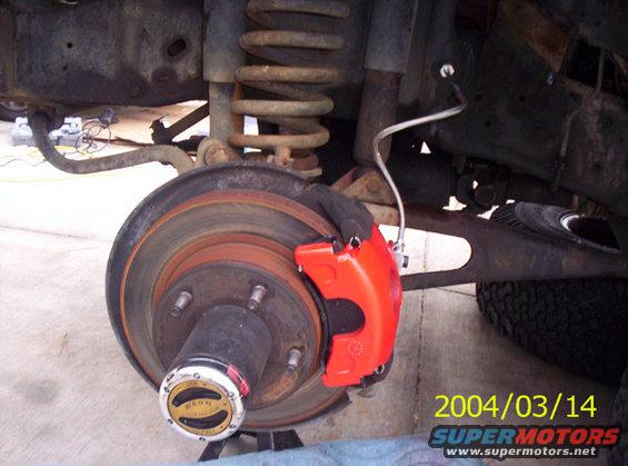 The caliper on the rotor, and the braided line connected to the line coming from the MC.I went ahead and put new pads on while I was down there as well.