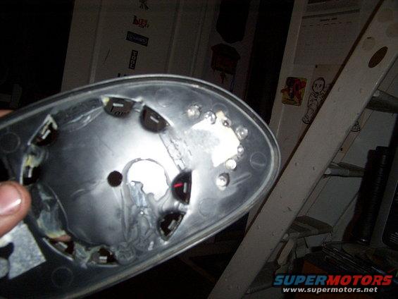 Car mirror housing with multiple LED sockets and a large central hole