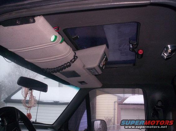overhead console with radio and CB, sun visor with lights, sunroof, and rearview mirror