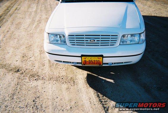 White 2000 Ford Crown Victoria front end with Nebraska license plate 9-D5231