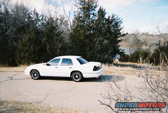 White 2000 Ford Crown Victoria sedan, side view