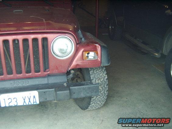 Red 1998 Jeep TJ front corner with license plate 123 XXA