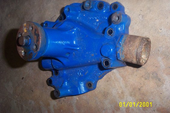 Blue water pump with rusted inlet and flange