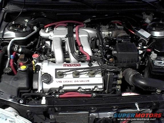 Mazda V6 DOHC 24-valve engine with red hoses and silver intake manifold
