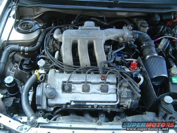 Mazda engine bay with V6 intake manifold and aftermarket air filter