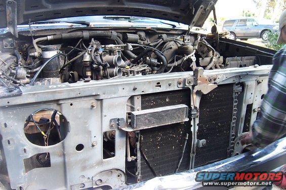 1989 Ford Bronco engine bay with hood open, showing engine components and radiator
