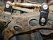 1995 Ford Probe - Close-up of an aftermarket adjustable suspension part mounted on a vehicle's undercarriage.