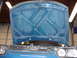 1998 Volkswagen Jetta - The underside of a car's hood is shown, revealing its internal structure and bracing.