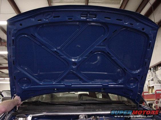 Blue hood underside with reinforcing beams and latch mechanism