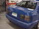 1998 Volkswagen Jetta - Rear view of a blue sedan with a license plate that reads MSNS2DRS and a damaged rear bumper.