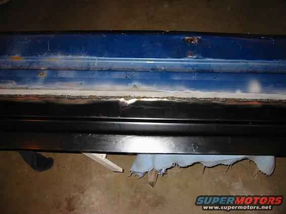 The new panel welded in place. (remember scrap off that so called black primer that comes on all new panels.)