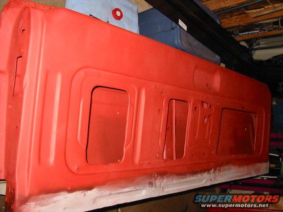 Tailgate all primed. This was actually before the new panel was put on. (I only got red primer because it was on sale, gray is easier to cover up but I was putting on 3 coats of paint anyway.