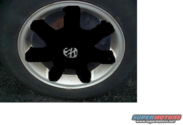 Wheel with blacked-out center and Volkswagen logo