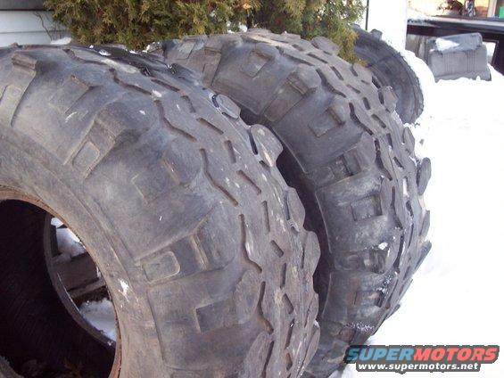 Tires with aggressive tread pattern piled in snow