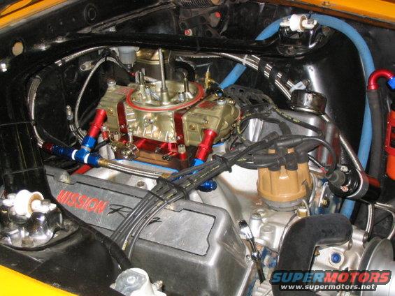 118_1855.jpg Jan 05 engine compartment.  BIGGS modified carb, and Roush intake
