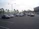 2002 Ford Taurus - Several cars are gathered in a parking lot, with a Macy's store visible in the distance.