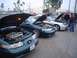 2002 Ford Taurus - Several Ford Taurus SHO models are displayed with their engines exposed at a car meet.
