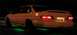 1995 Ford Taurus - This 1995 Ford Taurus is seen from the rear at night, green underglow lighting and a spoiler.