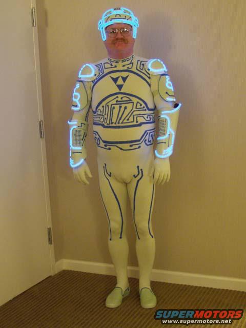 Person in a white and blue Tron-like costume with glowing blue accents