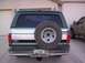 1996 Ford Bronco - The rear of a 1996 Ford Bronco is shown, a spare tire and a license plate.