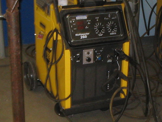 yellow multimaster 260 welding machine with cables and controls
