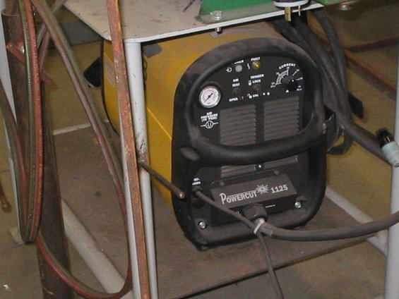 Yellow and black Powercut 1125 plasma cutter with gauges and controls