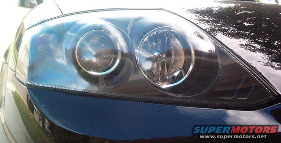 tibbyhead1.jpg Removed orange reflector and inner housings painted black.