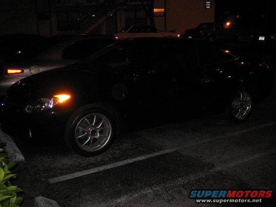 2004 Toyota Solara coupe parked at night, front passenger side visible