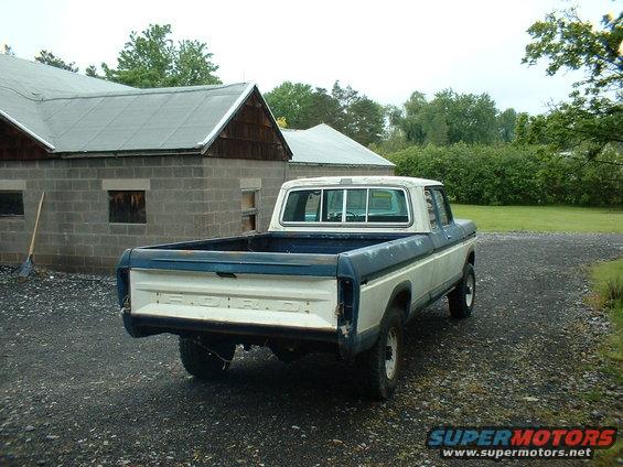 Rear view of a 1978 Ford F-250 pickup truck with a white cab and blue bed