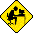 Yellow diamond warning sign with black border showing a person sitting at a desk with a computer