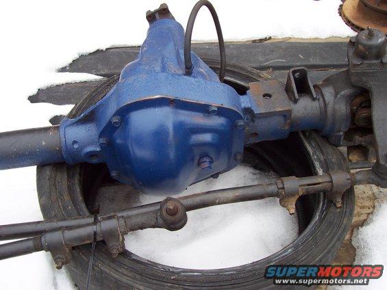 Blue painted Ford rear axle assembly with tie rods and brake line