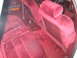 1988 Mercury Grand Marquis - Interior view of a 1988 Mercury Grand Marquis, showing the red velour seating and carpeting.