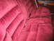 1988 Mercury Grand Marquis - The plush velour interior features a bench seat with prominent stitching and a seatbelt.