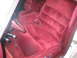 1988 Mercury Grand Marquis - The interior of a car with red velour seats and carpeting is shown.
